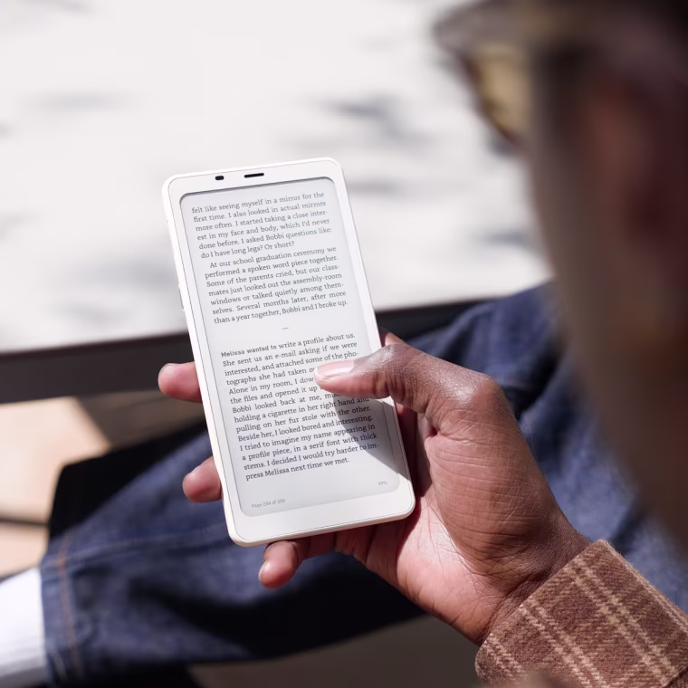An over-the-shoulder shot of a person holding the Boox Palma 2.