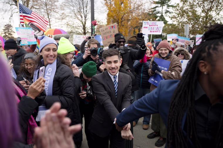 Chase Strangio, the first transgender attorney to argue before the Supreme Court, with supporters on Dec. 4, when the court heard the case of U.S. vs. Skrmetti.