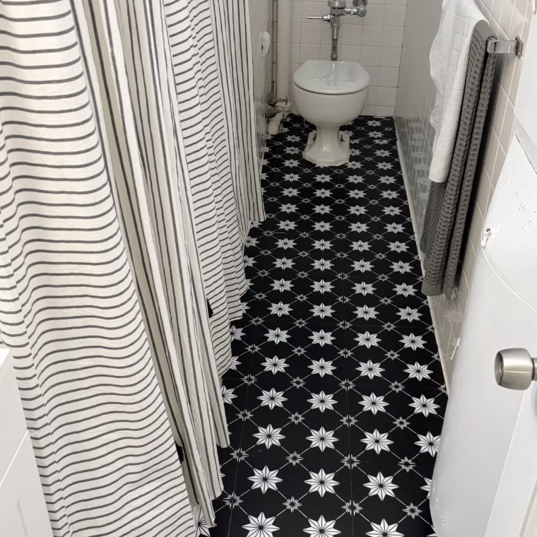 Geometric floor pop tiles in a bathroom.