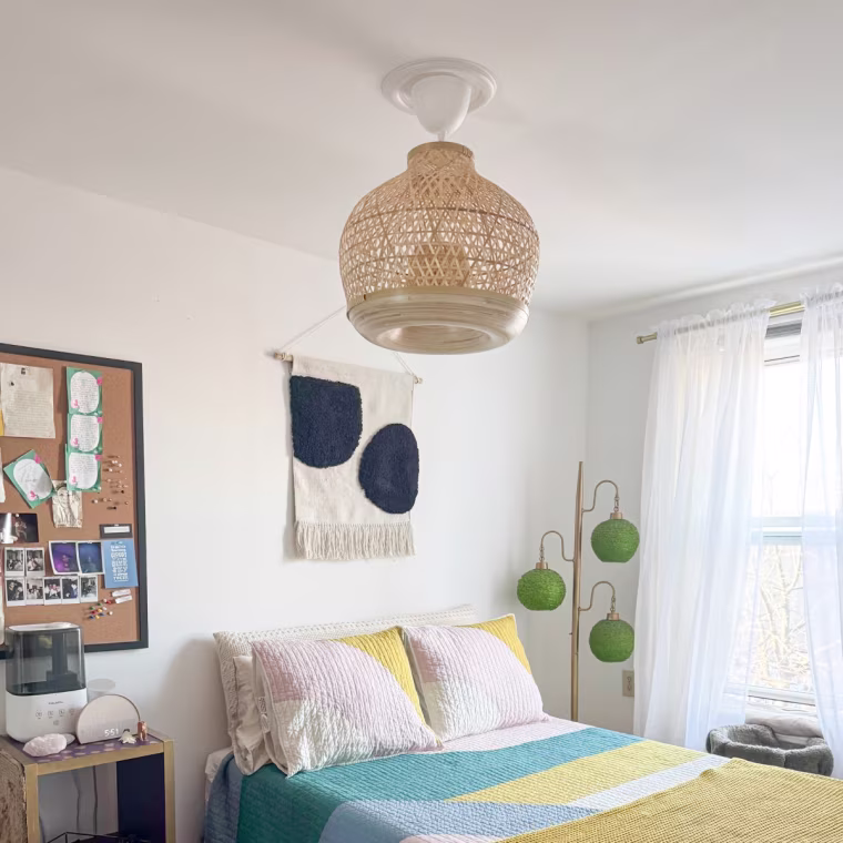 Ikea Misterhult Pendant Lamp hanging from the ceiling in a bedroom.