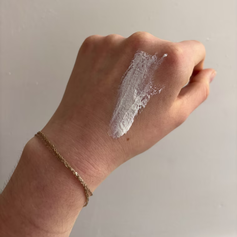 Sunscreen on the back of woman’s hand