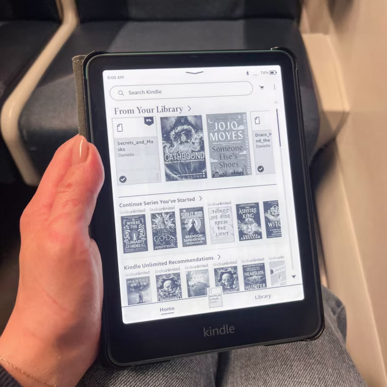 Commerce writer Danielle Murphy using the Kindle Paperwhite Signature Edition.