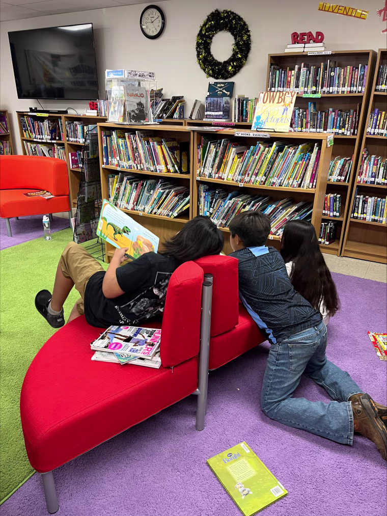Children reading in the Santa Clara Pueblo Community Library.