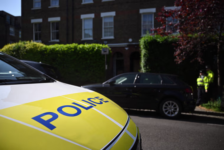 Police officers patrol outside the home of British Prime Minister Keir Starmer in London on May 13, 2025.