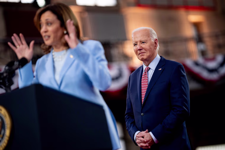Kamala Harris standing at a lectern introduces Joe Biden during a campaign rally in Philadelphia, Pennsylvania.