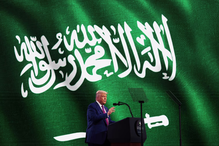 President Donald J. Trump stands at a lectern on stage and addresses