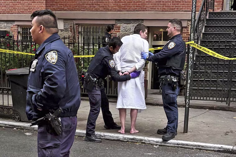New York police officers arrest John Woeltz on May 23, 2025, in New York.