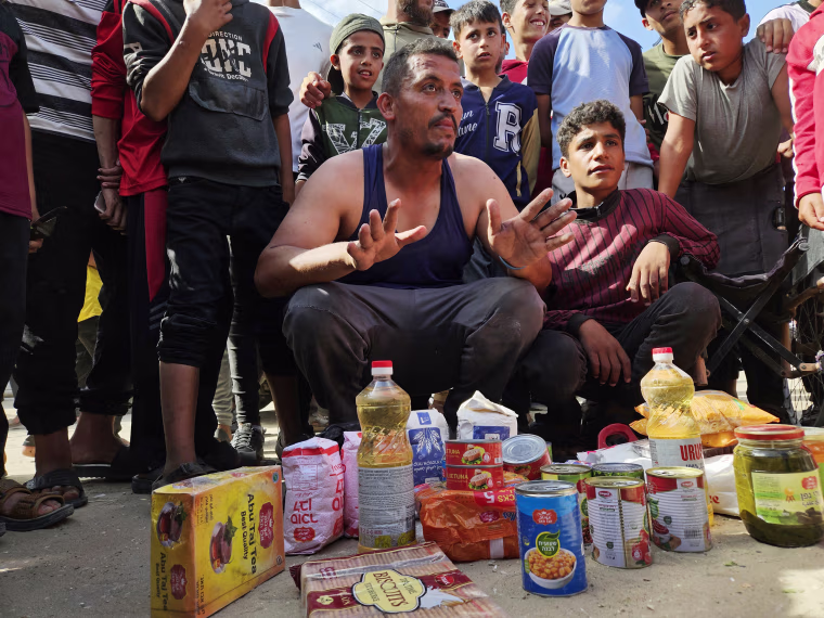 Thousands of Palestinians flock to aid distribution point in southern Gaza