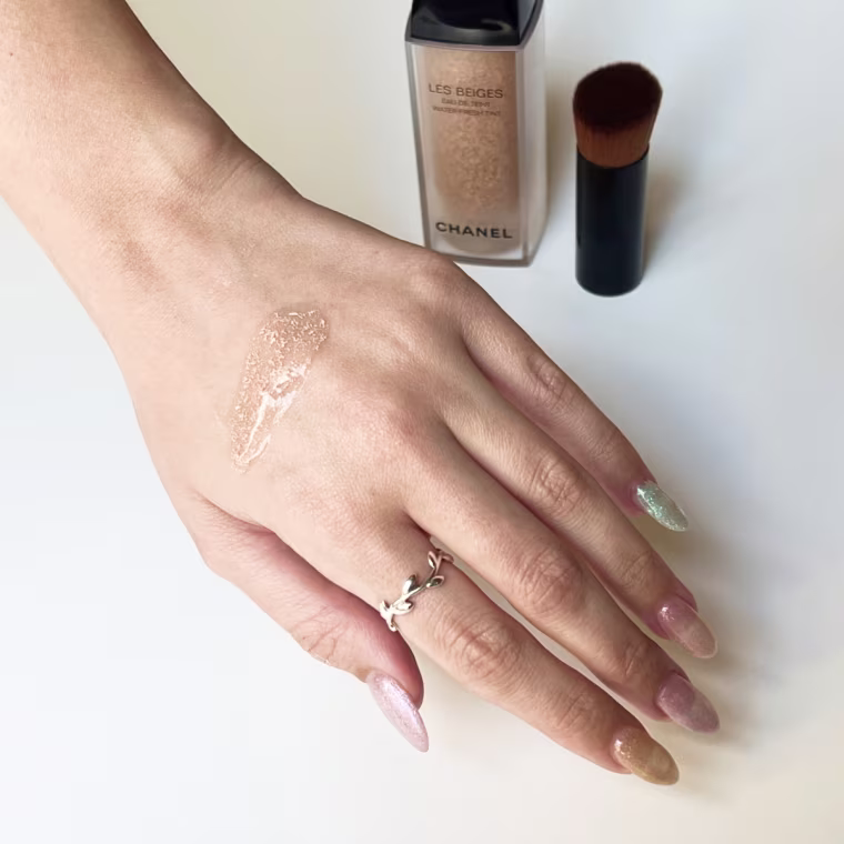Swatch of the Chanel foundation on back of woman’s hand