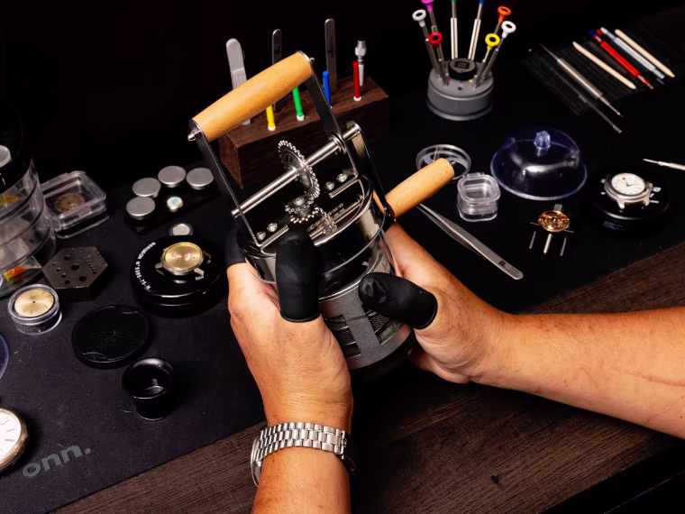 Mendoza using the Chrono Clean in his closet workshop.
