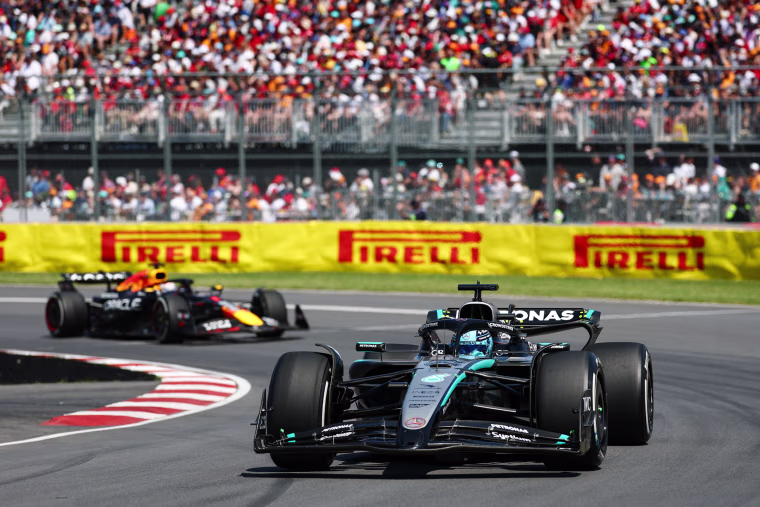 George Russell of Great Britain driving the (63) Mercedes AMG Petronas F1 Team W16 leads Max Verstappen of the Netherlands driving the (1) Oracle Red Bull Racing RB21 on track