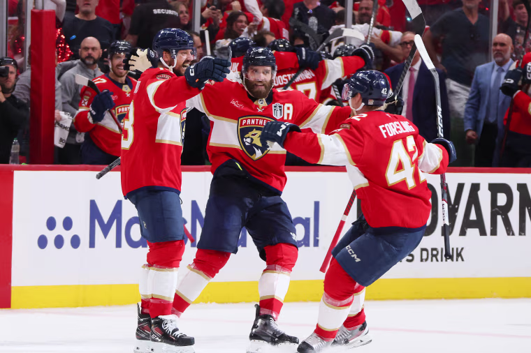 Image: 2025 Stanley Cup Final - Game Six Sam Reinhart #13 of the Florida Panthers celebrates with Carter Verhaeghe #23 and Gustav Forsling