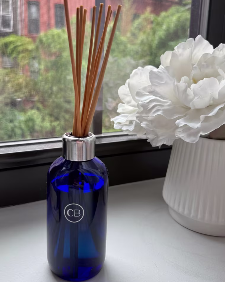 A photo of the Capri Blue Volcano reed diffuser on a counter