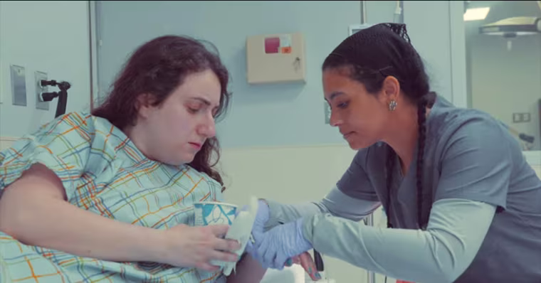 Zeroonian, left, shares a hospital scene with Brittany Friedman in her movie about living with cyclic vomiting syndrome. The film was partially made possible by Belmont Media Center in Belmont, Massachusetts.