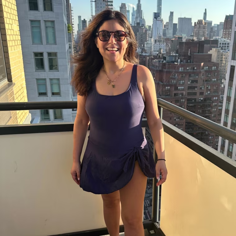 Editorial director Adrianna Brach models the Eomenie Tummy Control Swim Dress.