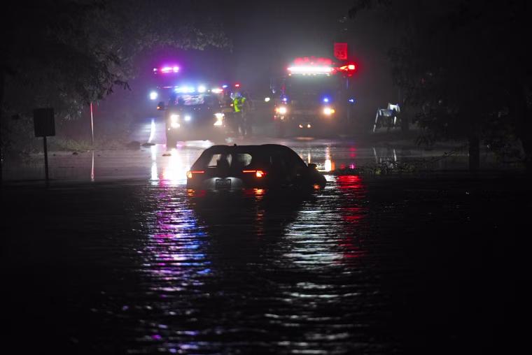 A car sits in floodwaters in Plainfield, N.J.