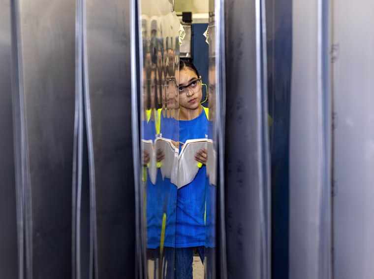 Vanessa Sanchez inspects printing plates.