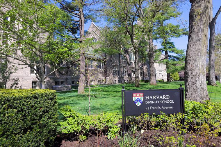 The Harvard Divinity School building exterior with the sign out front