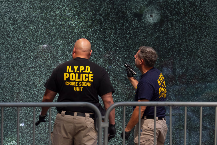 Investigators look at bullet holes
