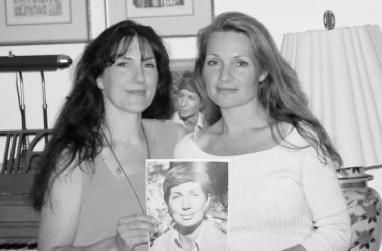Kimberly and Justine holding a photo of Nancy