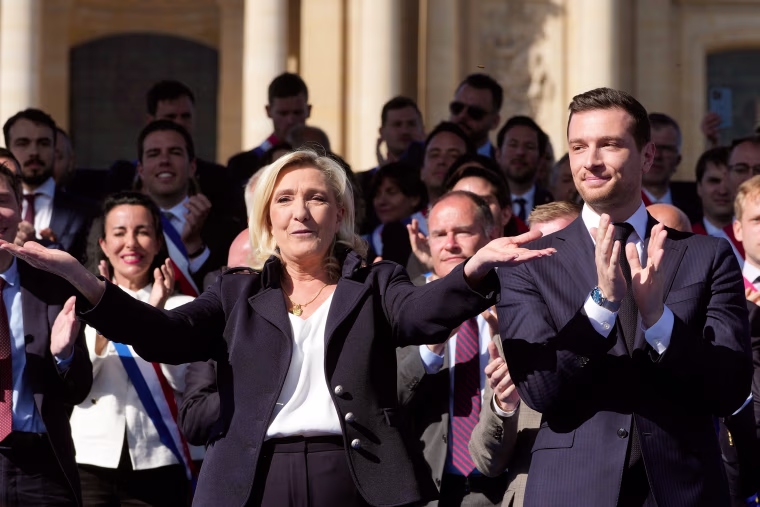 Marine Le Pen and Jordan Bardella at a party national rally