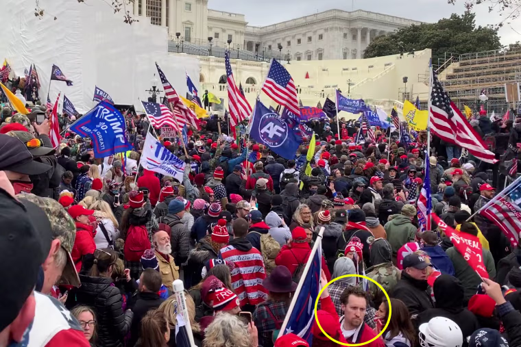 E.J. Antoni, circled on the bottom right, in a crowd of protestors