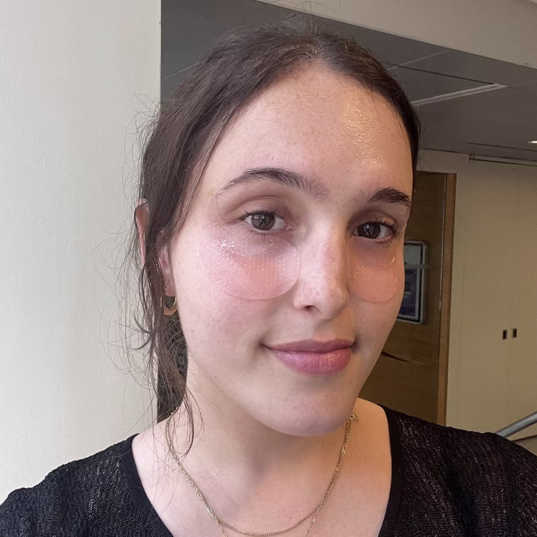 Woman wearing Abib patches under her eyes