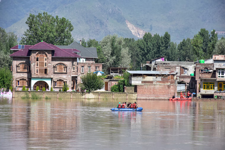 Members of the State Disaster Response Force (SDRF) evacuate