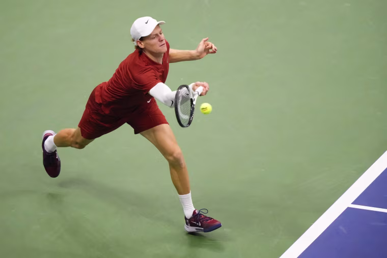 Image: Jannik Sinner returns a shot to Carlos Alcaraz during the men's singles final of the U.S. Open.