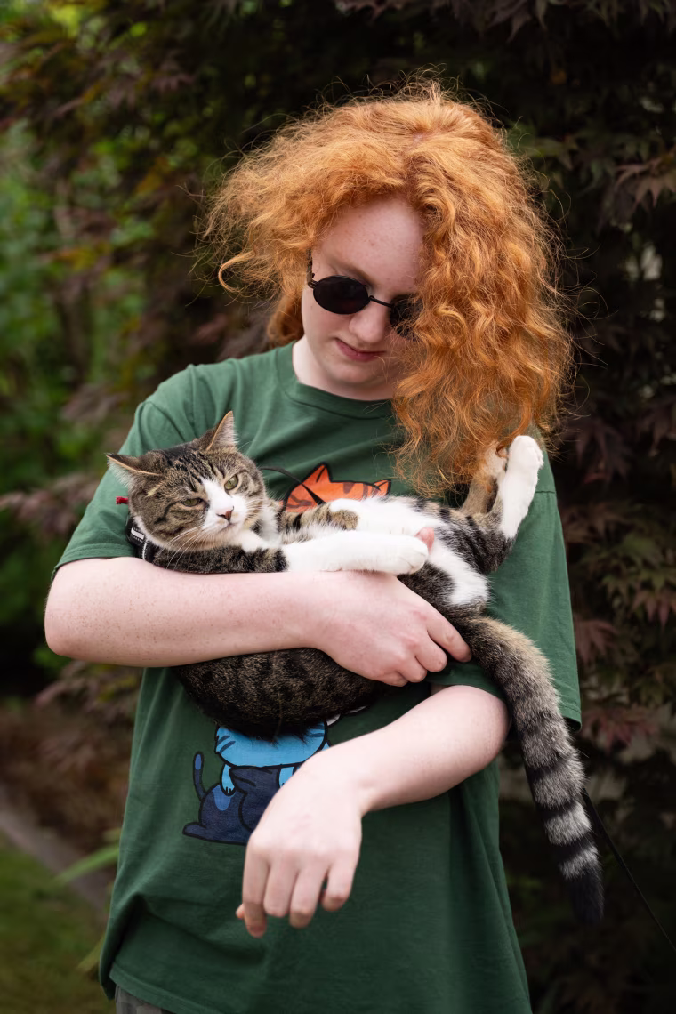 Adam with the family cat.