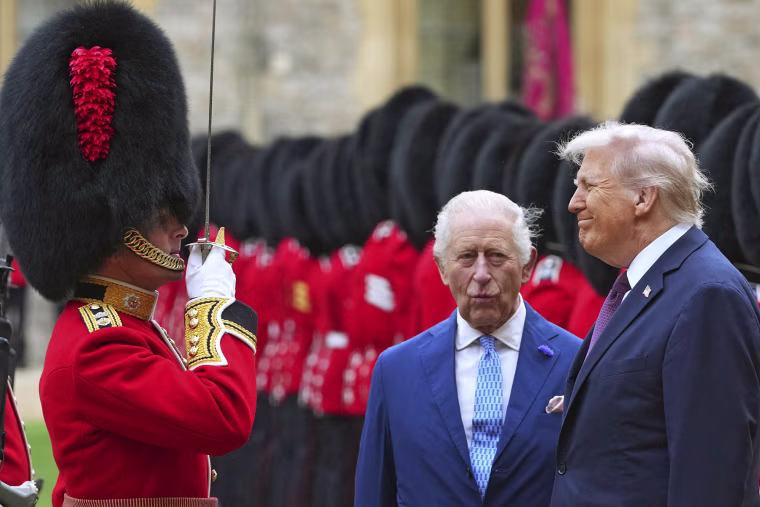President Donald Trump and Britain's King Charles III inspect a Guard of Honour during in the Quadrangle at Windsor Castle, in Windsor, on September 17, 2025.