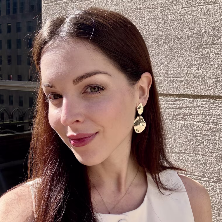 Editor Shannon Garlin in the Pavoi 14K Teardrop Statement Dangle Earrings