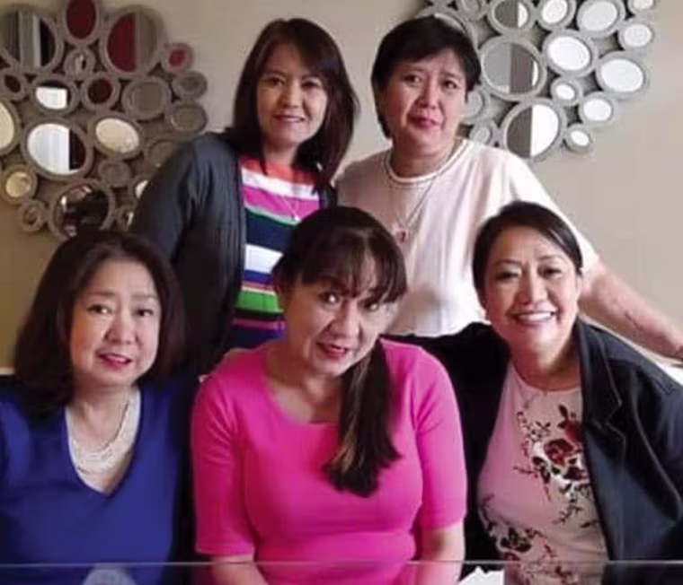 Paula Del Mundo with her sisters
