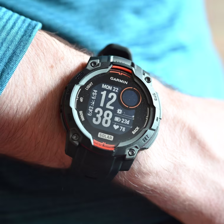 A close-up of the Garmin Instinct 3 Solar on the wrist of the writer.