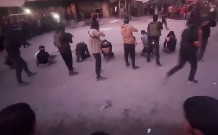Masked gunmen prepare to execute a group of men in Gaza City.