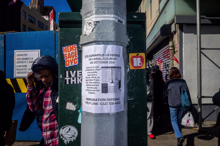 A letter on a pole outside reads "ICE kidnapped 40 people on Canal/Church on October 21st"
