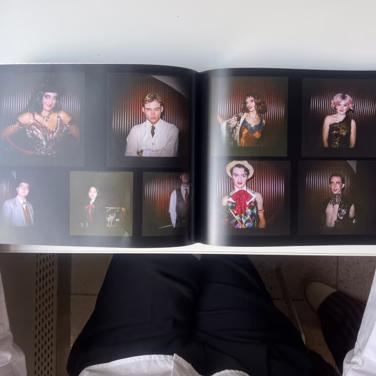 Woman flipping through Printique photo book