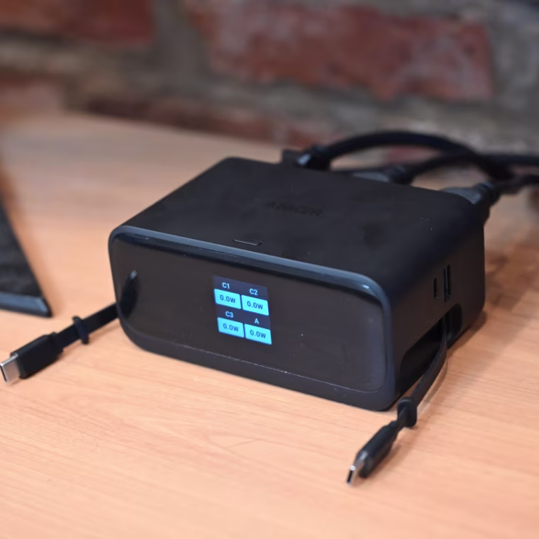 A close up of the Anker Nano 100W Charging Station against a wooden desk.