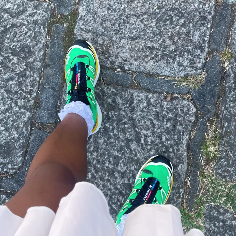A close up of the Salomon Xt-6 sneakers on a cobblestone path.
