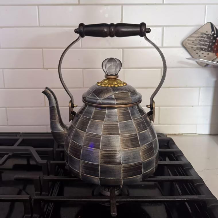 Close up of Makenzie Childs' checkered teapot