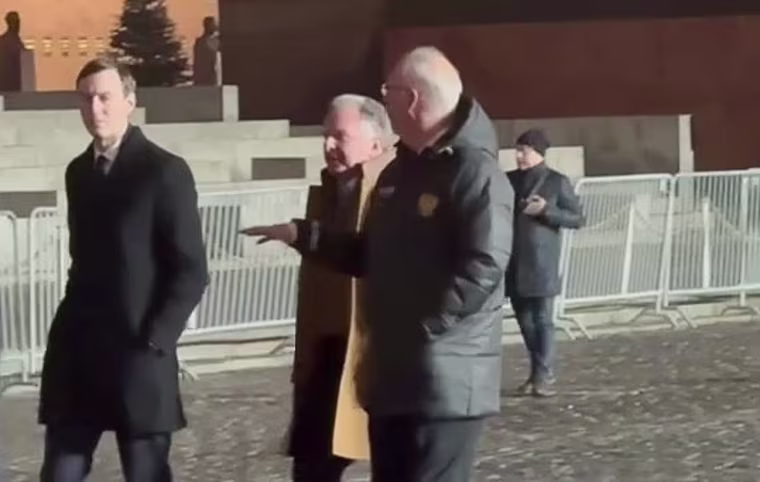From left, Jared Kushner, presidential envoy Steve Witkoff and Kirill Dmitriev, one of Russia's key negotiatiors, walk through Red Square before a scheduled meeting with Russian President Vladimir Putin in Moscow on Dec. 2, 2025.