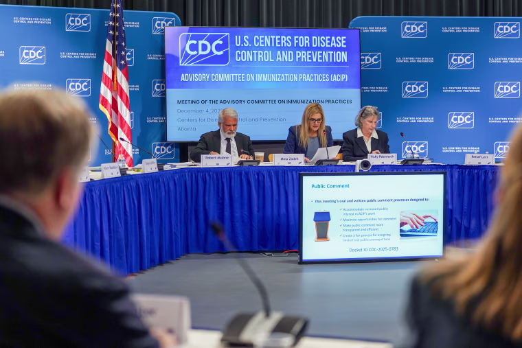Committee member Dr. Robert Malone, Dr. Mina Zadeh, executive secretary of the CDC's Advisory Committee On Immunization Practices, and committee member Vicky Pebsworth during a meeting of the CDC's Advisory Committee On Immunization Practices at the CDC headquarters in Atlanta, Ga. on Thursday.