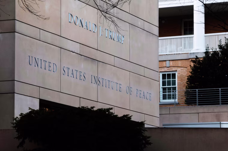 President Donald Trump's name is seen recently placed on the outside of the U.S. Institute of Peace headquarters on Dec. 3, 2025 in Washington, D.C.