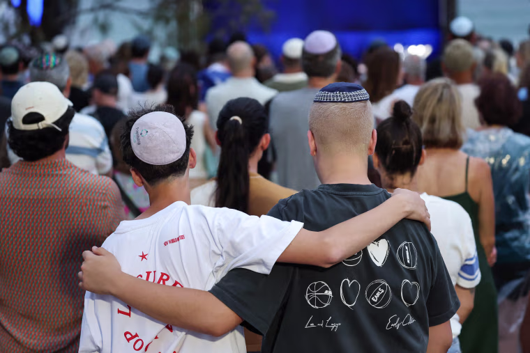 Mourners attend a memorial on Dec. 21 held for the victims of a shooting at Bondi Beach in Sydney.