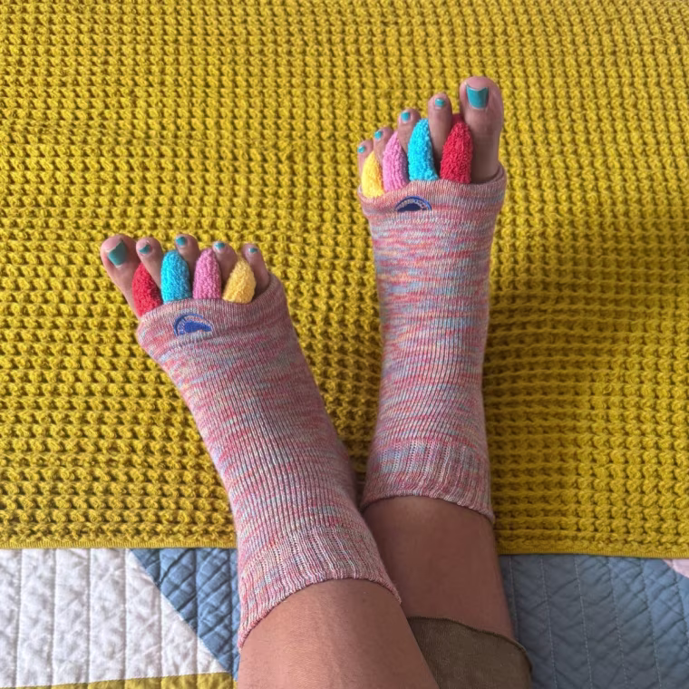 Woman wearing colorful foot alignment socks
