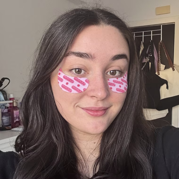 Woman wearing pink under-eye patches