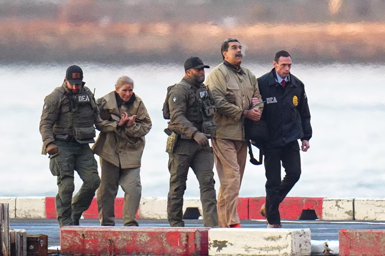 New US indictment accuses former Venezuelan President Nicolás Maduro of torture 1 Nicolas Maduro and his wife, Cilia Flores, handcuffed