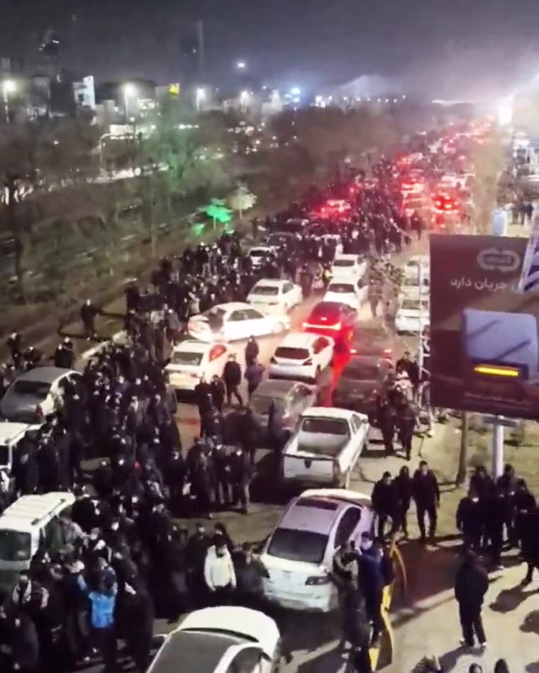 People gather on the streets during a protest in Mashhad