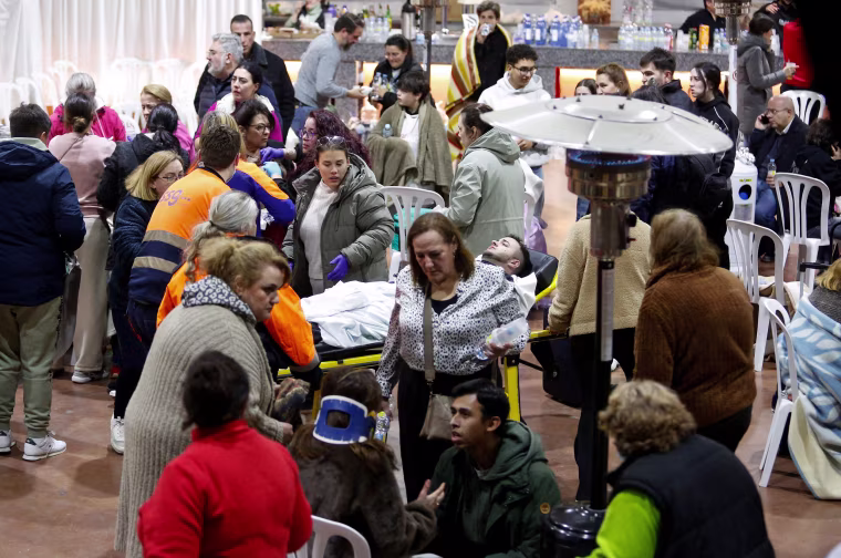 People affected by a deadly train derailment are transferred and treated at the Caseta Municipal in the town of Adamuz