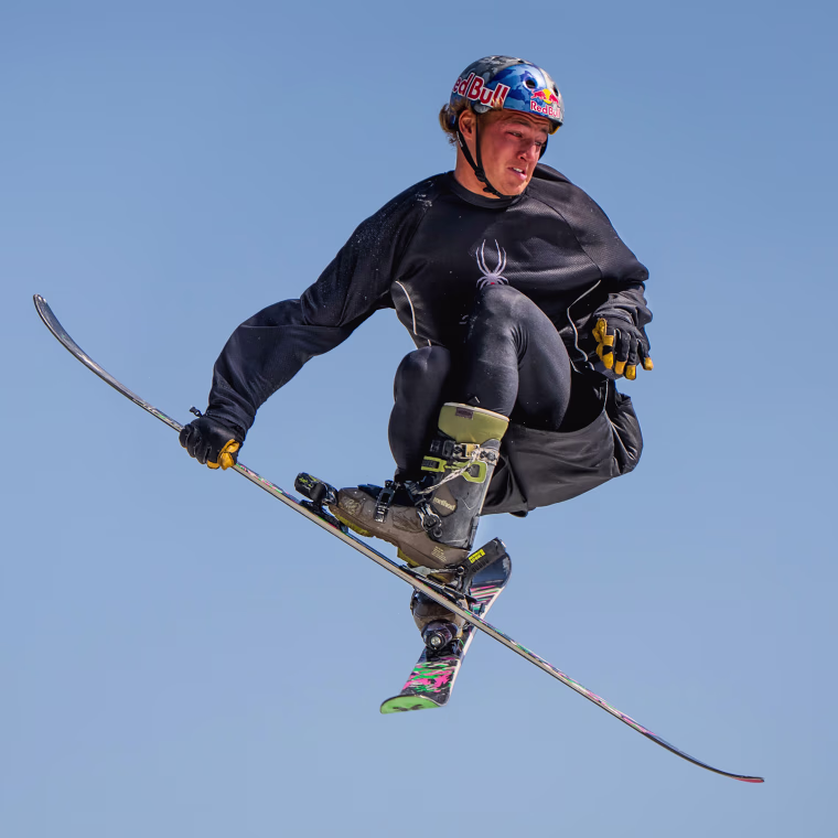 Freestyle skier Mac Forehand practices a switch triple cork 1980 mute while jumping onto an airbag